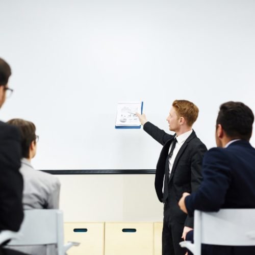 Analysis of market Ambitious financier or director of company explaining his subordinates principles of market development